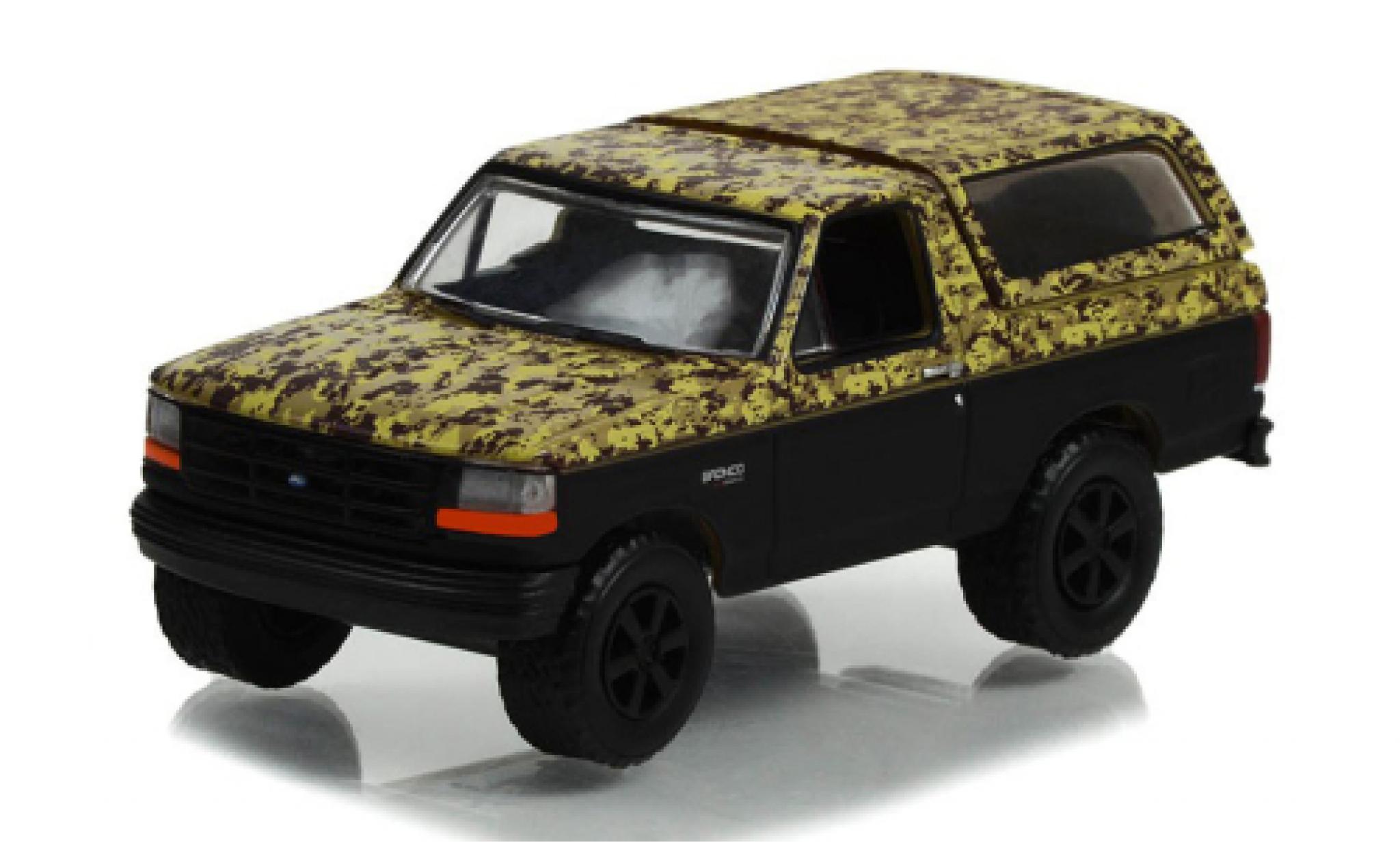 Ford Bronco 1/64 Greenlight Dekor/zwart 1996 modelauto