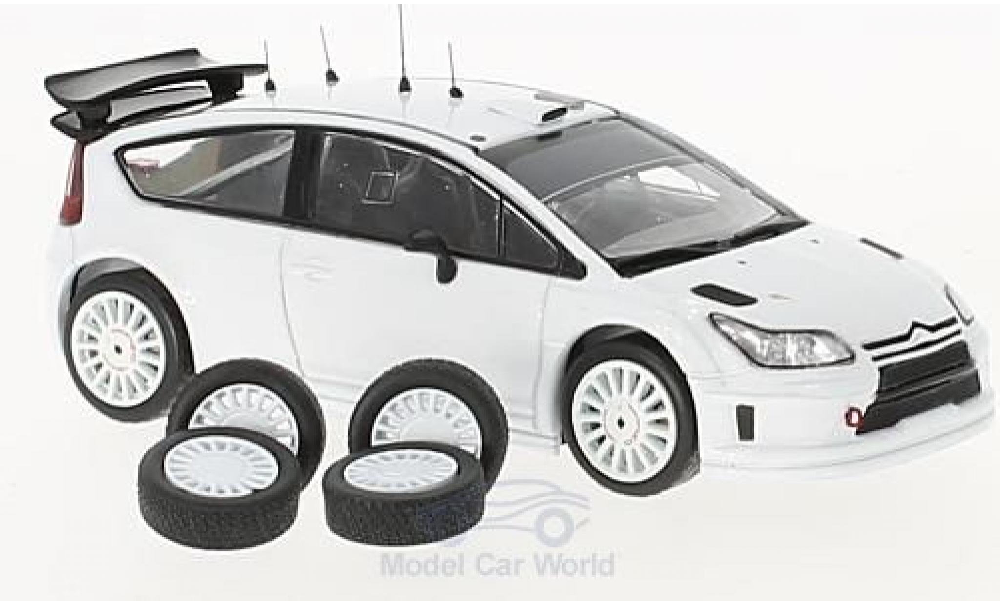Citroen C4 WRC 1/43 IXO WRC wit 2010 Plain Body Version inklusive 4 Ersatzr&auml;der modelauto