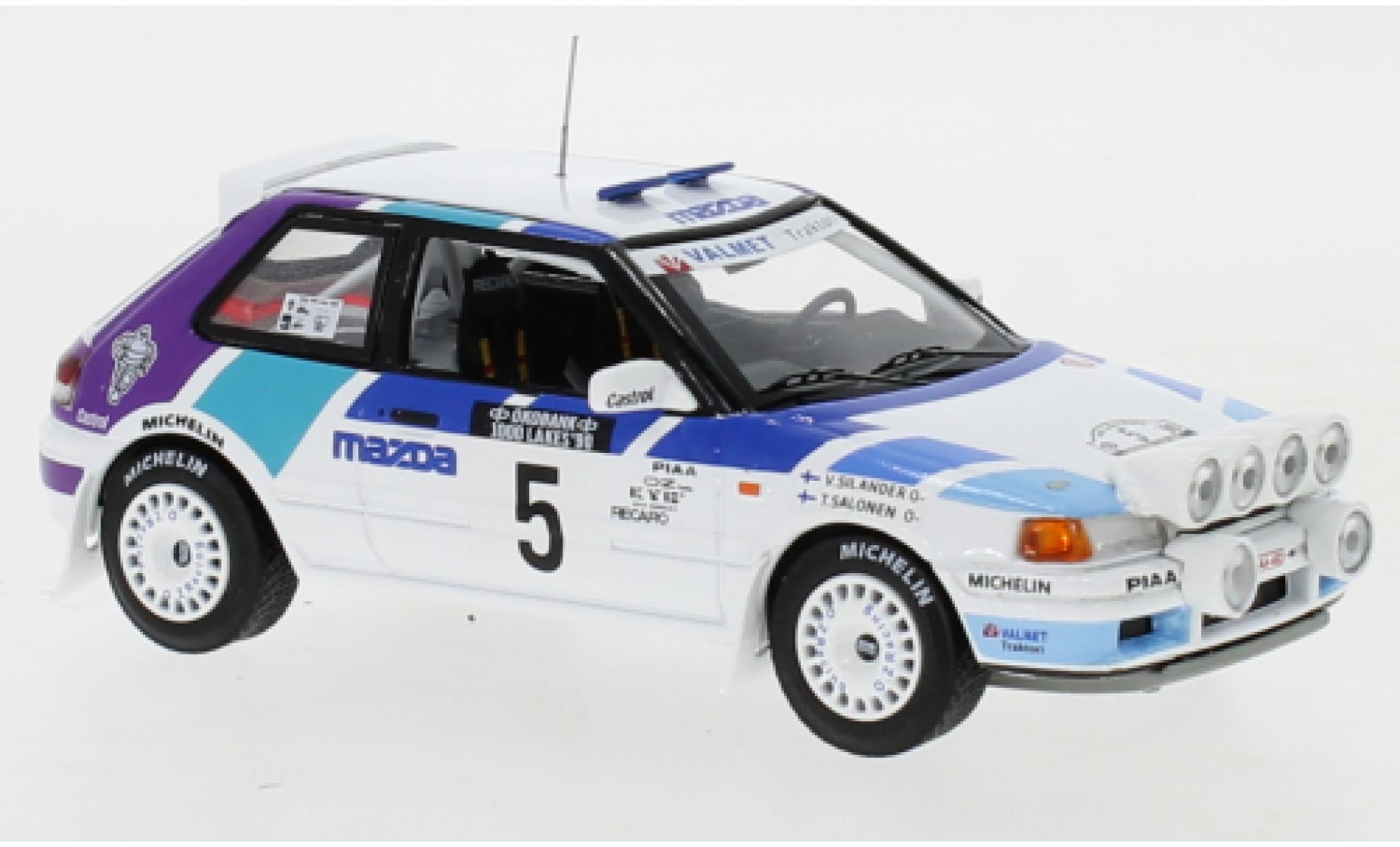 Mazda 323 1/43 IXO GTX No.5 Rally Team Europe 1000 Lakes Rallye 1990 with night lights T.Salonen/V.Silander modelauto