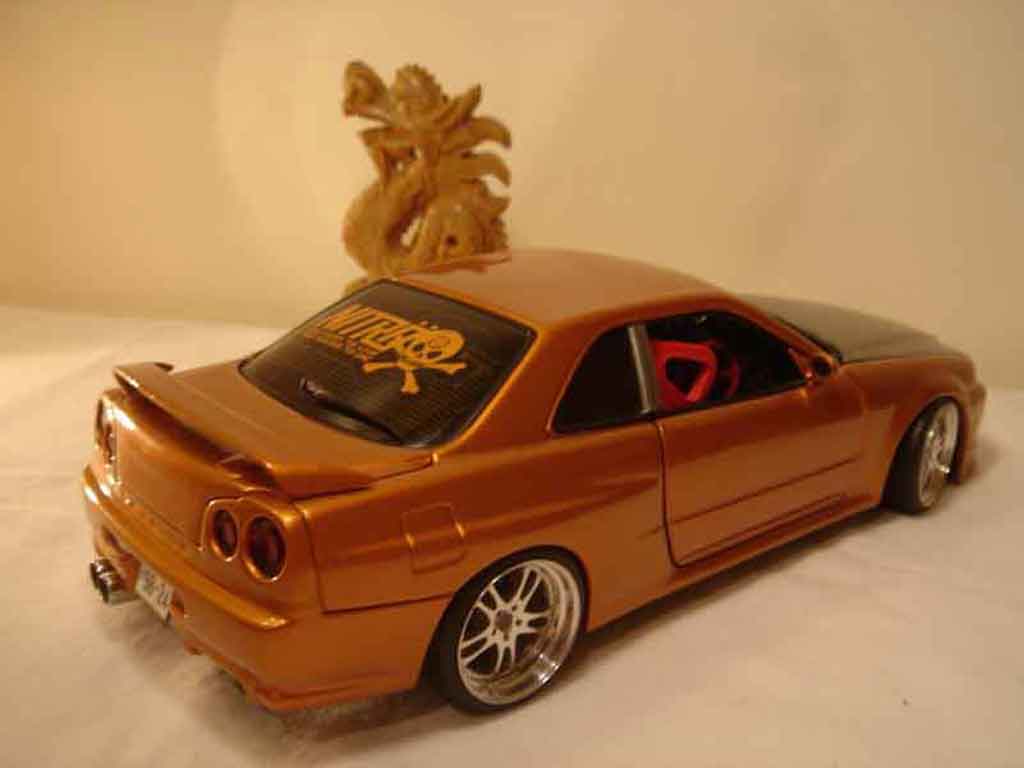 Nissan Skyline R34 oranje carbon kit nos 1/18 Autoart