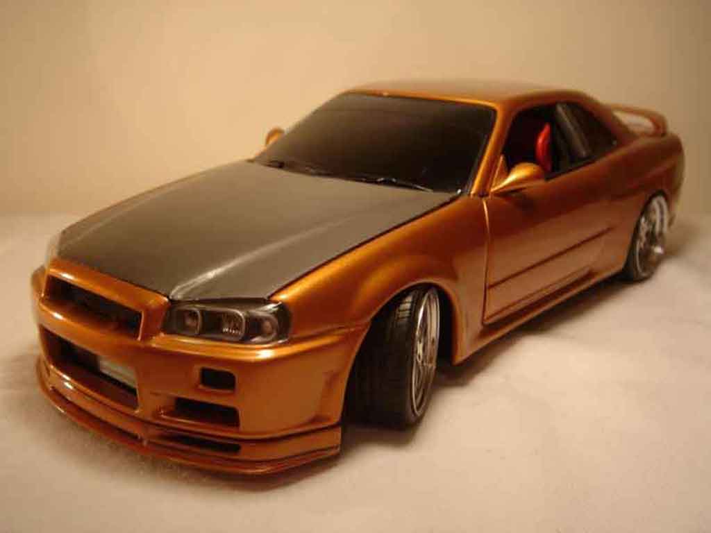 Nissan Skyline R34 1/18 Autoart R34 oranje carbon kit nos modelauto