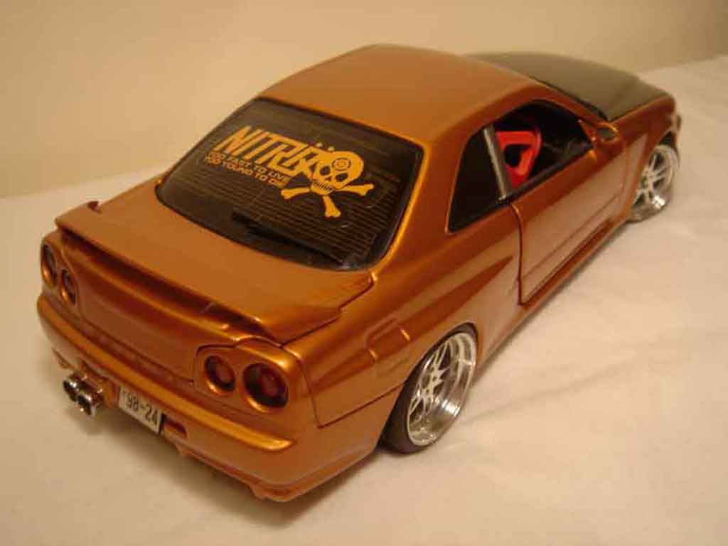 Nissan Skyline R34 oranje carbon kit nos 1/18 Autoart