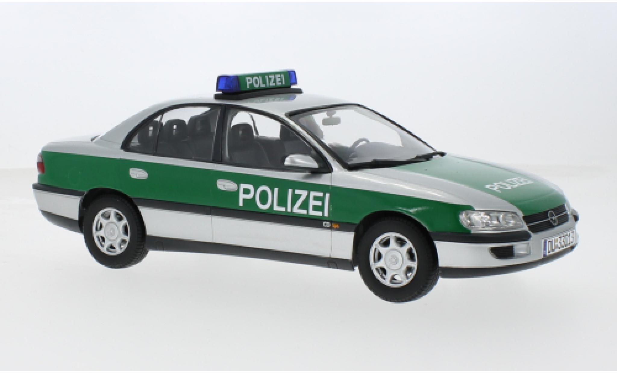Opel Omega 1/18 Triple 9 Collection B Politie (D) 1996 1:18 modelauto