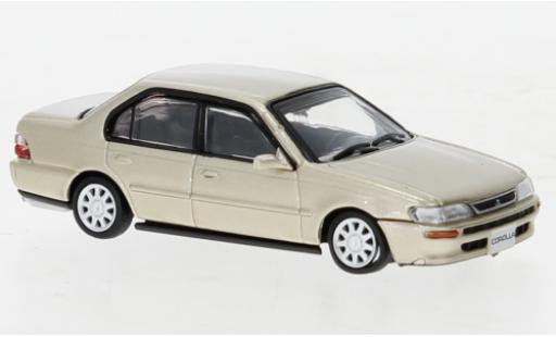 Modelauto Toyota Corolla AE100 metallic beige 1996 1/64 BM Creations