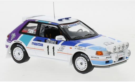 Modelauto Mazda 323 GTX No.11 Rally Team Europe 1000 Lakes Rally 1990 with night lights H.Mikkola/A.Hertz 1/43 IXO