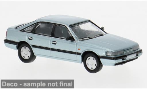 Modelauto Mazda 626 Base 2 blauw 1987 1/87 PCX87
